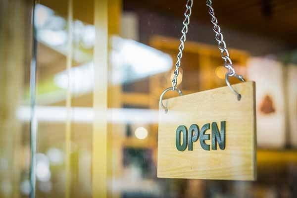 Clean shop front windows with open sign